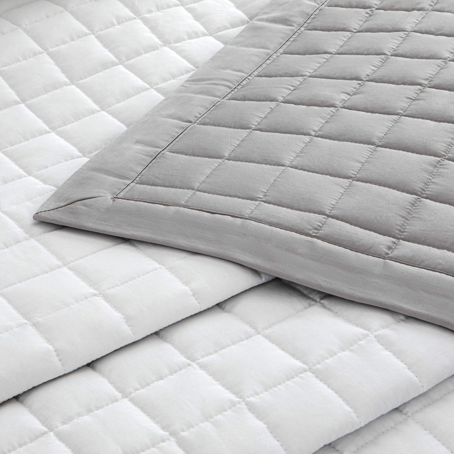 Egyptian cotton sateen reversible quilted throw in subtle grey and white